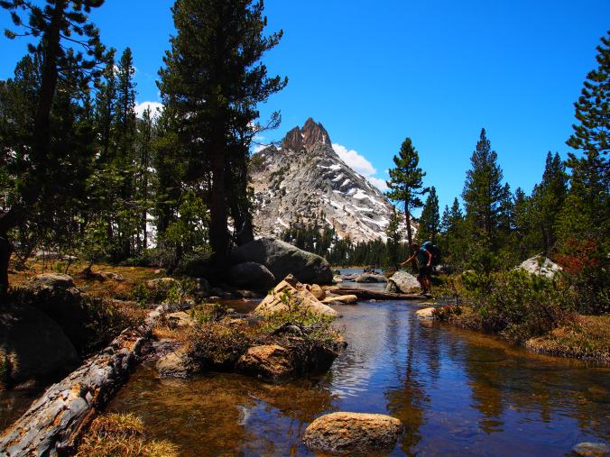 Stream hopping, Ragged Peak in the background